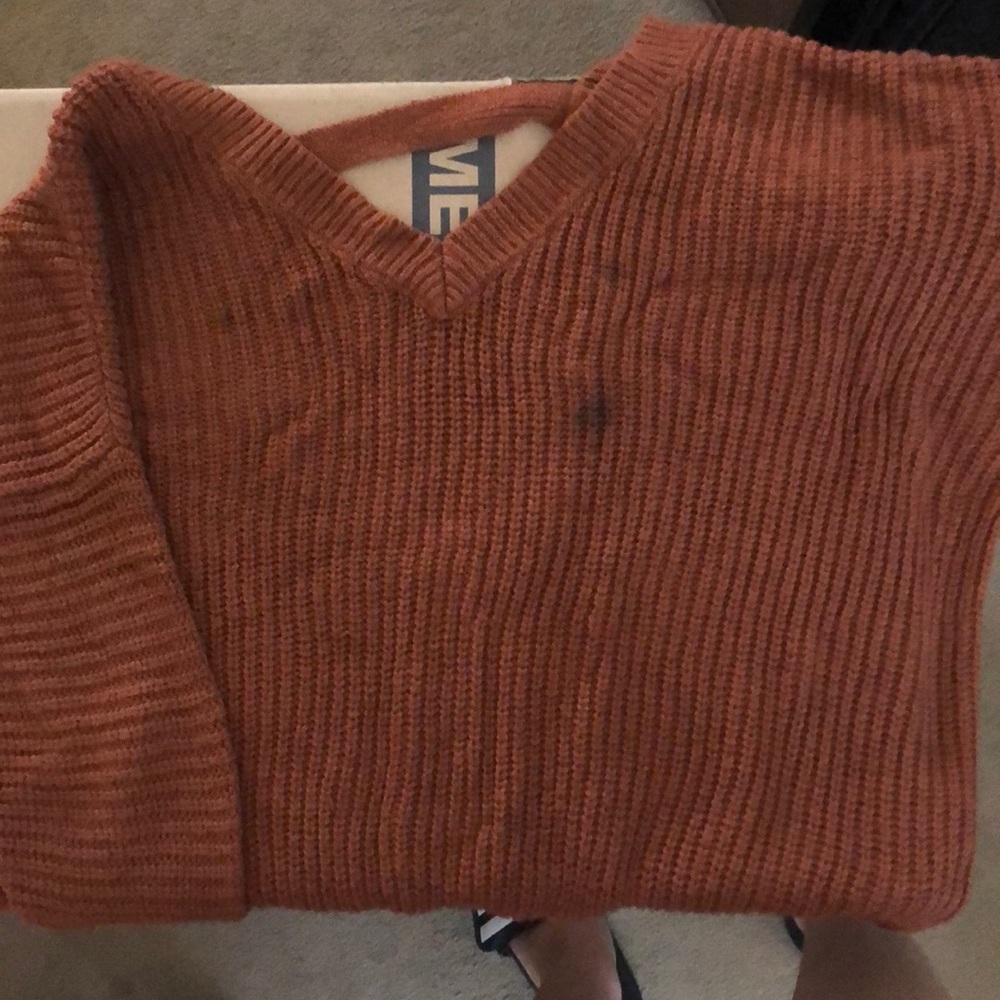 Knit sweater in burnt orange color
